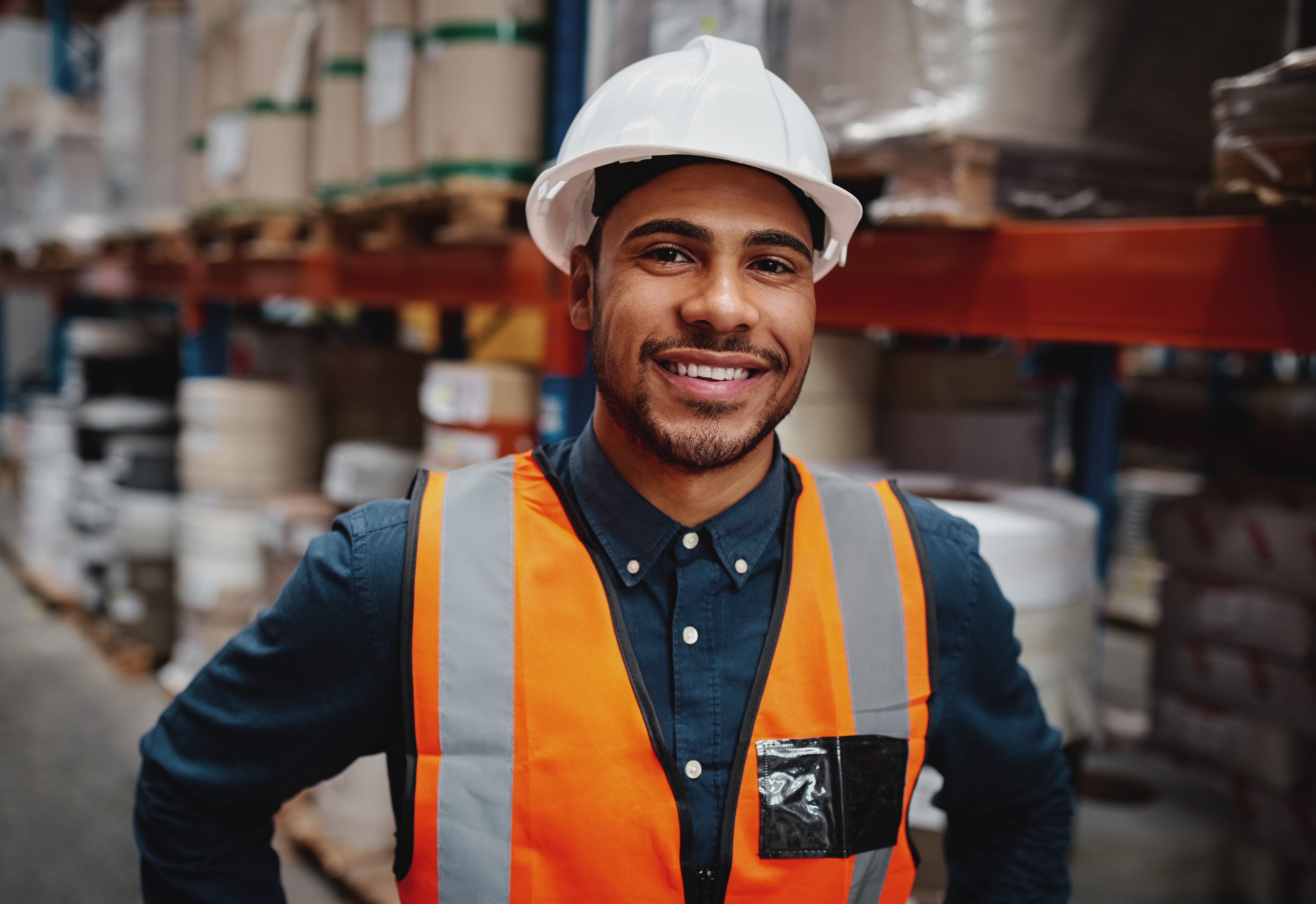 An image of a warehouse working making the warehouse run more efficiently.