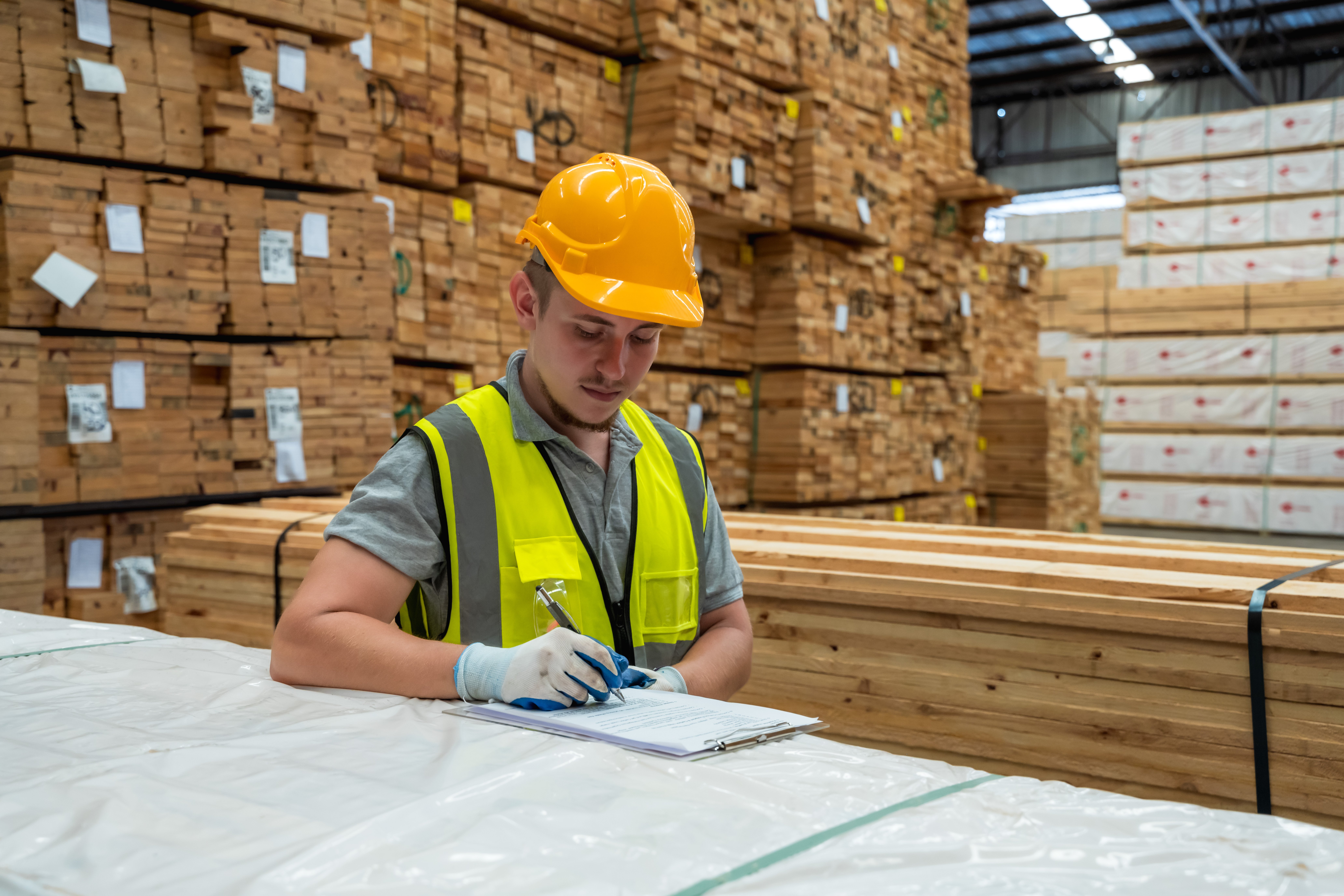An image of a hardware store warehouse worker taking an inventory.