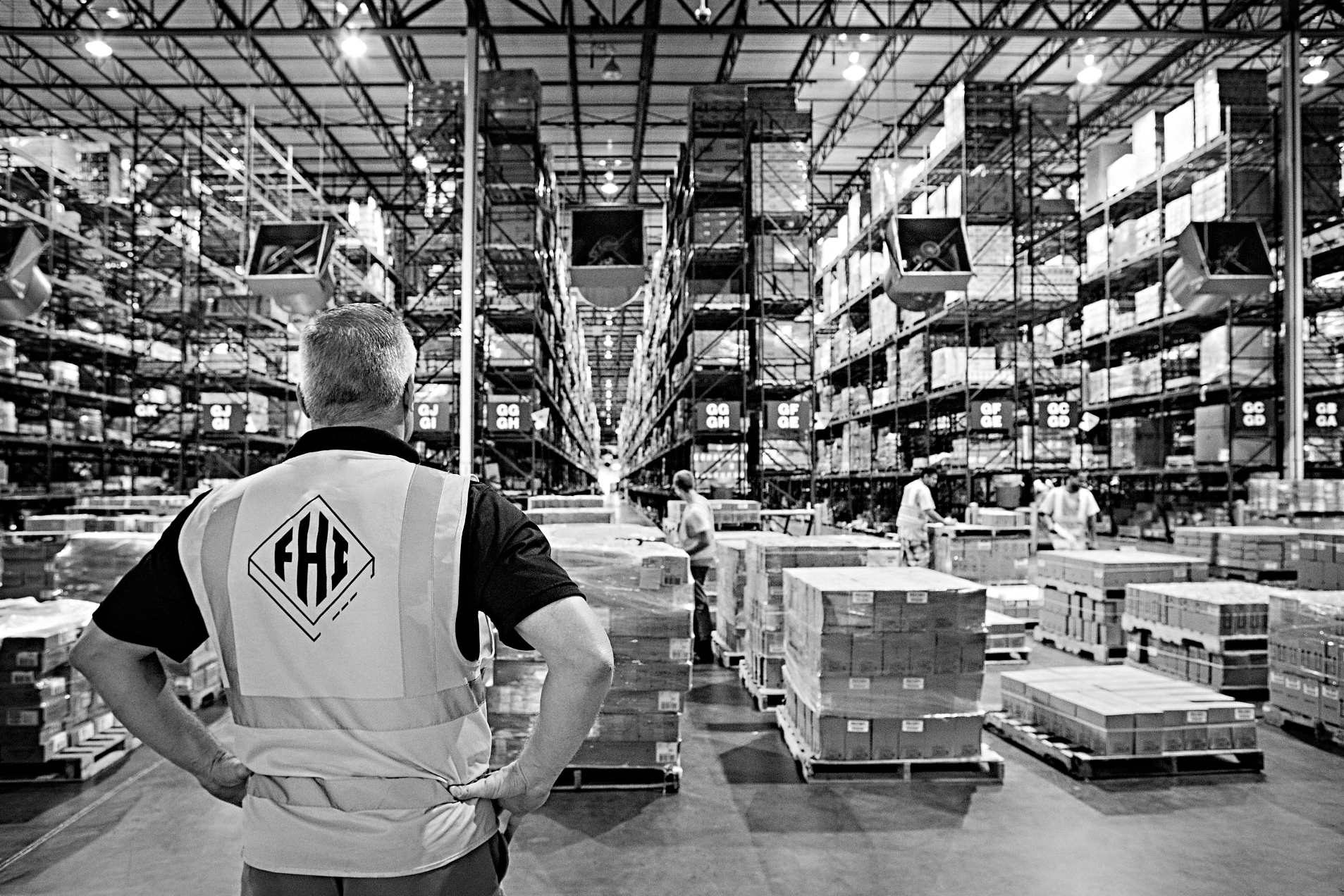 An image of an FHI worker at a warehouse dealing with supply chain challenges.
